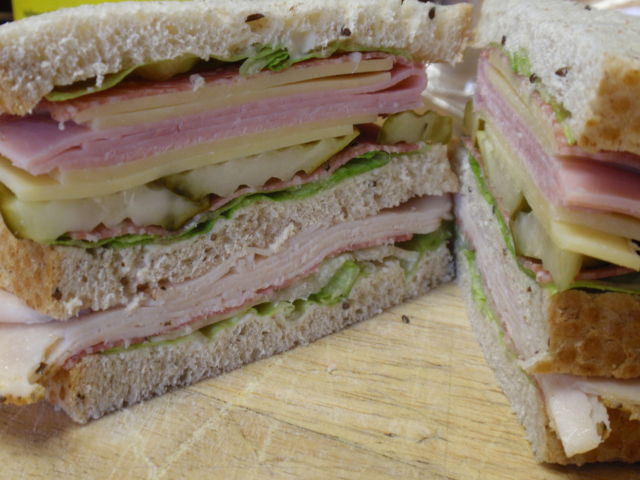 this baby has light mayo, sweet pickles, ham, volpi salami, italian roasted turkey breast and swiss cheese!