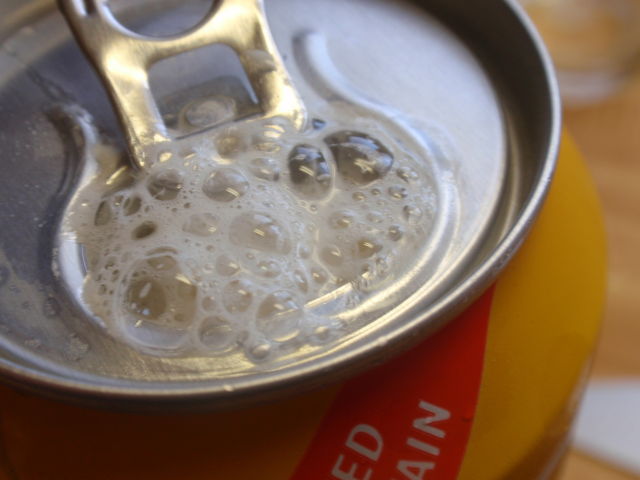 It has a small Co2 ball in the bottom of the can.  Open it, and if at all possible, wait a full two minutes for the beer to develop - you will not be disappointed!