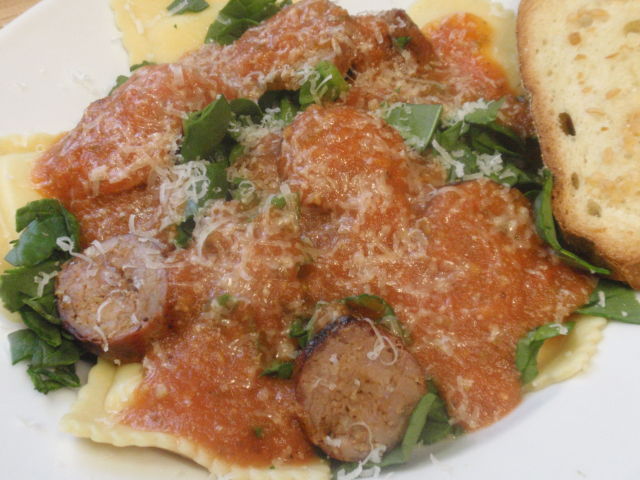 All dressed!  1 serving ravioli, 1.5 ounces sausage, 1 cup chopped fresh spinach, 1 garlic bread = dinner comes in at 549 calories, 30 fat and 39 carbs
