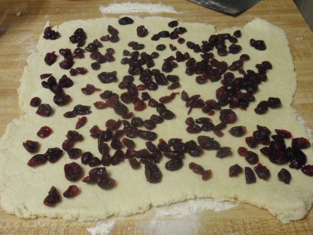 roll to 12x12 square and add craisins, pressing in so they stick