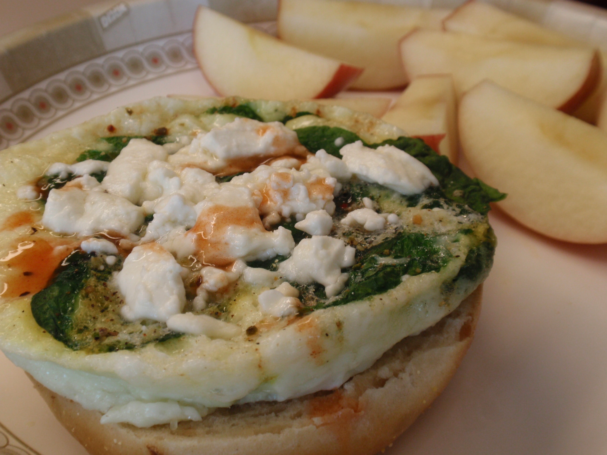 1/2 onion bagel, 1/2 cup egg whites, handful of spinach, ff feta cheese, TABASCO, and small fuji apple