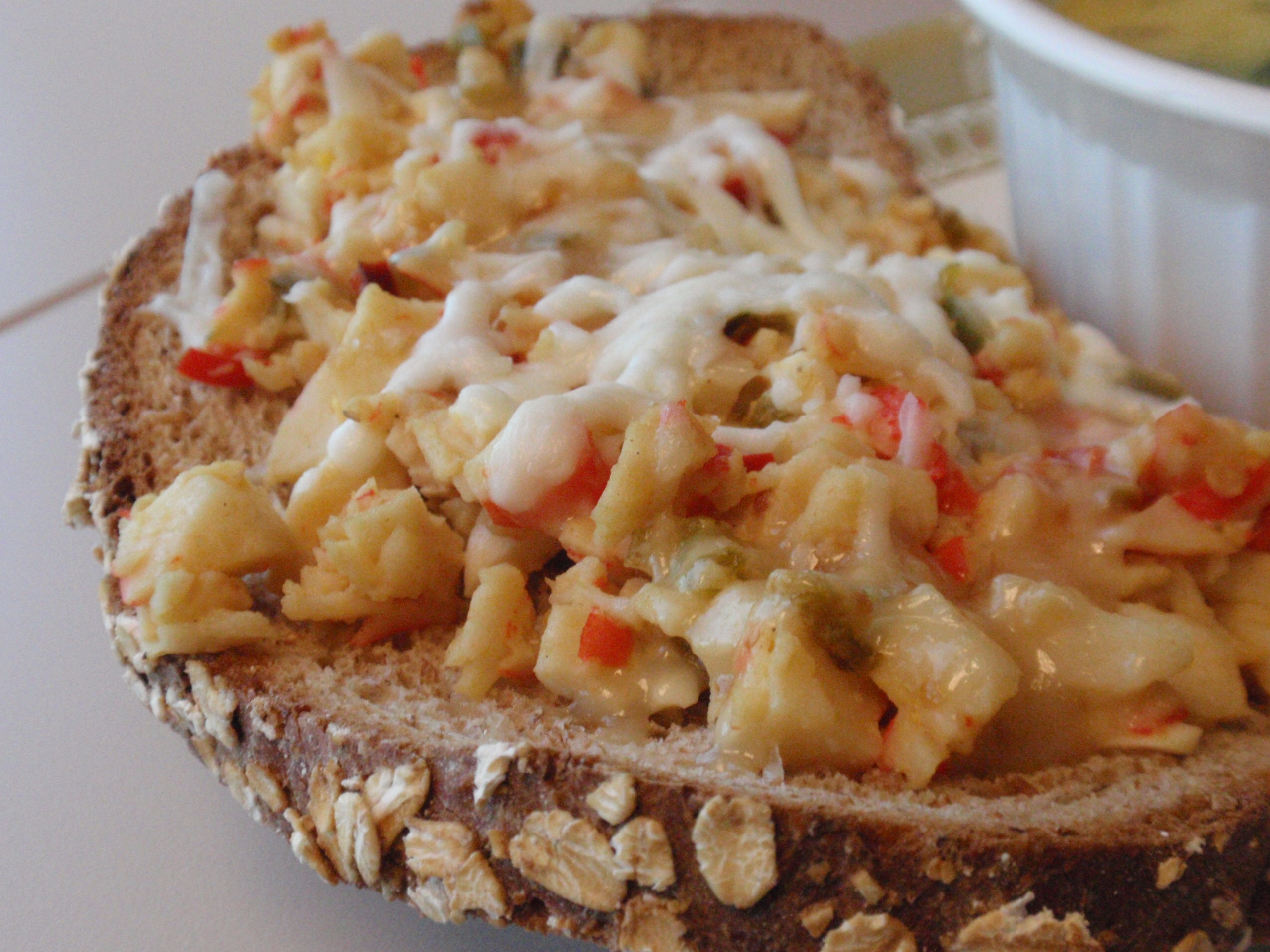 I spread my crab mixture on my low carb bread and added 1/2 ounce smoked gouda, and 1/2 ounce of mozzarella and just popped it in the toaster oven for 5 minutes - yum!