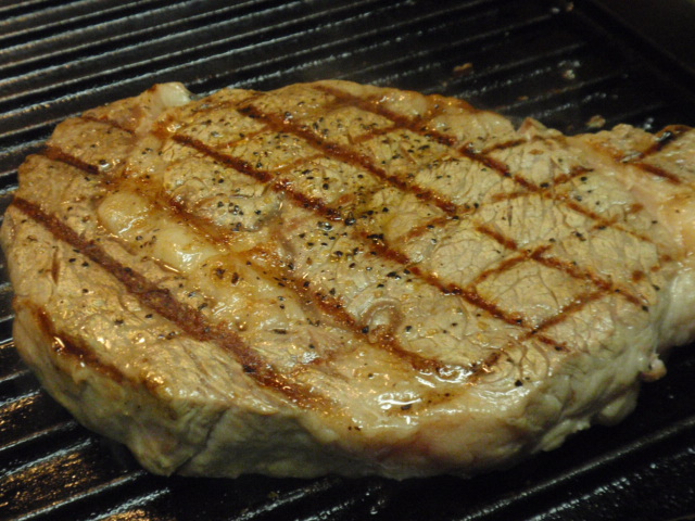 I have a cast iron grill pan - it gets pretty hot - for this size steak, I cooked on 3 minutes per side for rare