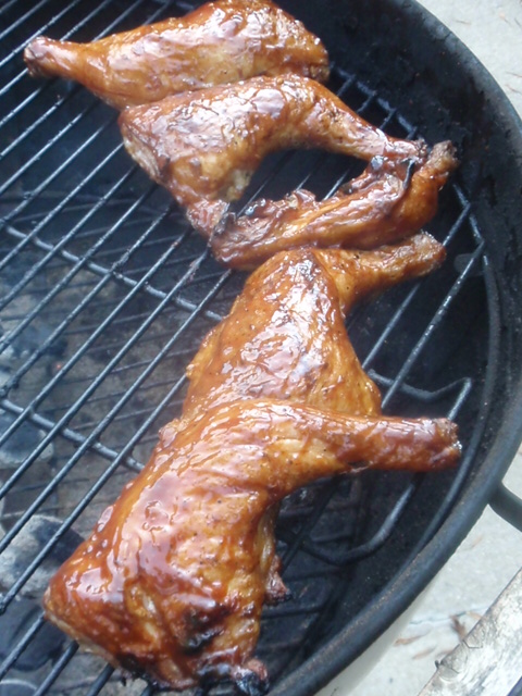 here's the chicken after its been seared, bbq sauce added, just chillin on the cool side